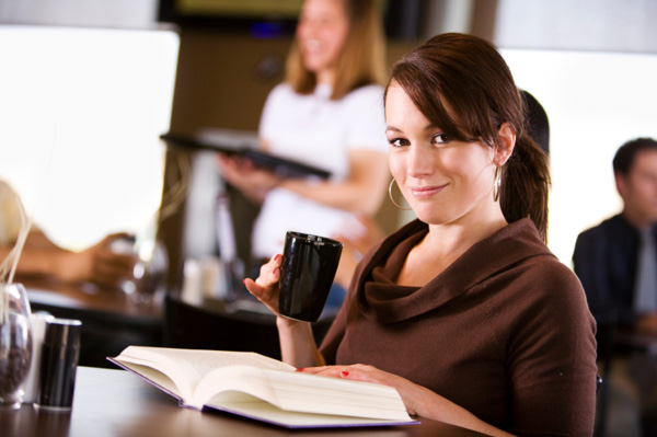 woman-at-cafe-reading-book